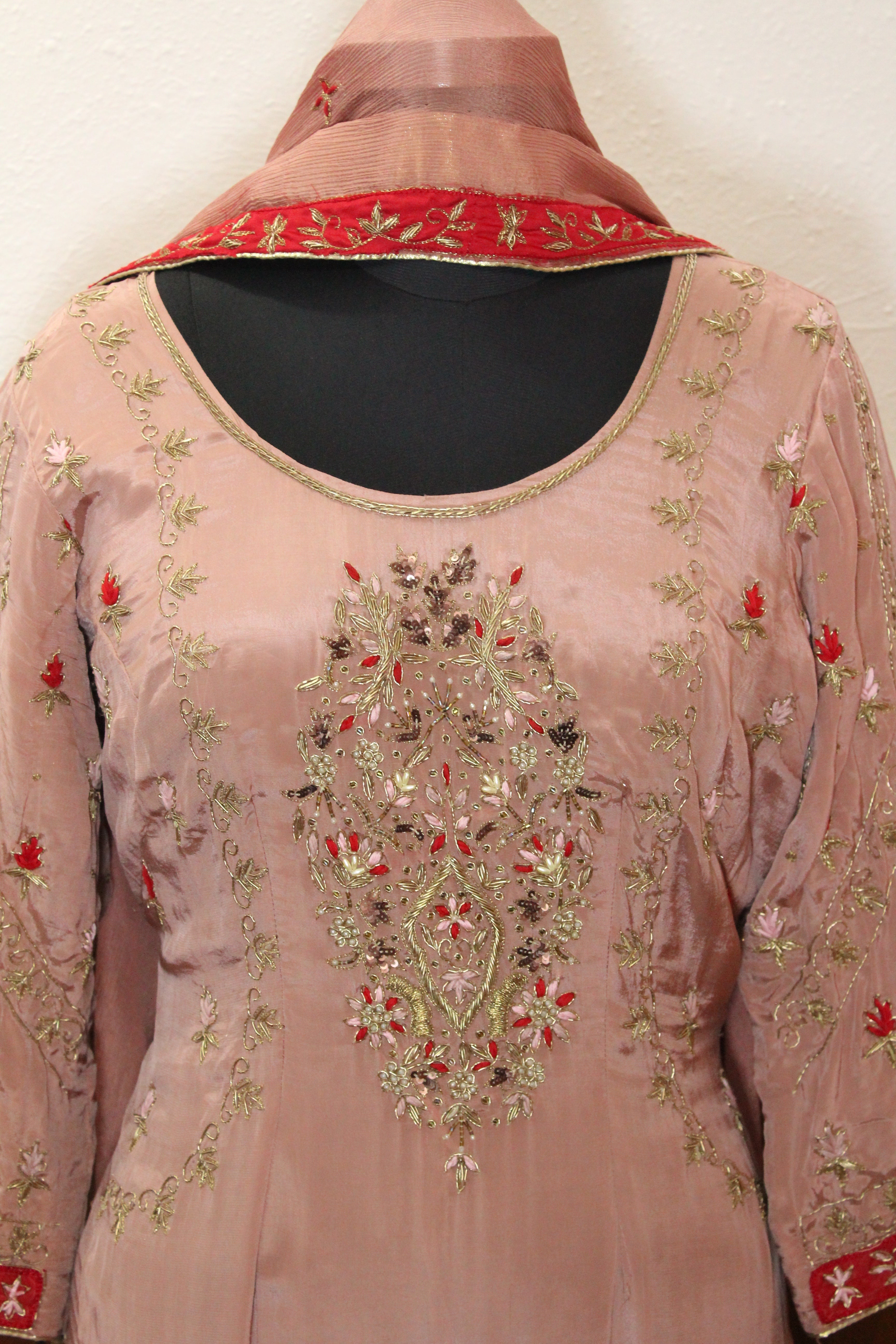 Gentle pink hue with shimmering embroidery