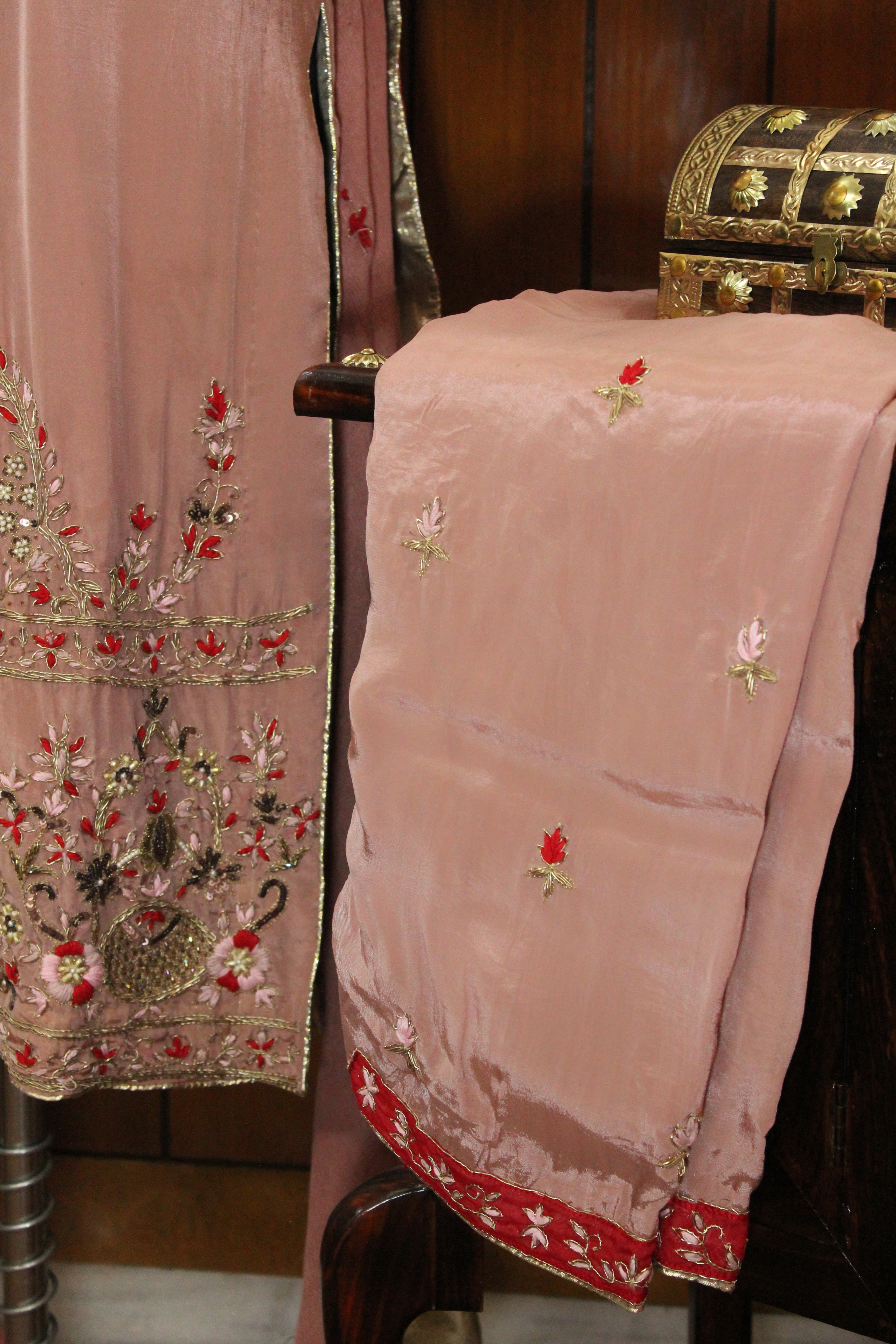 Gentle pink hue with shimmering embroidery