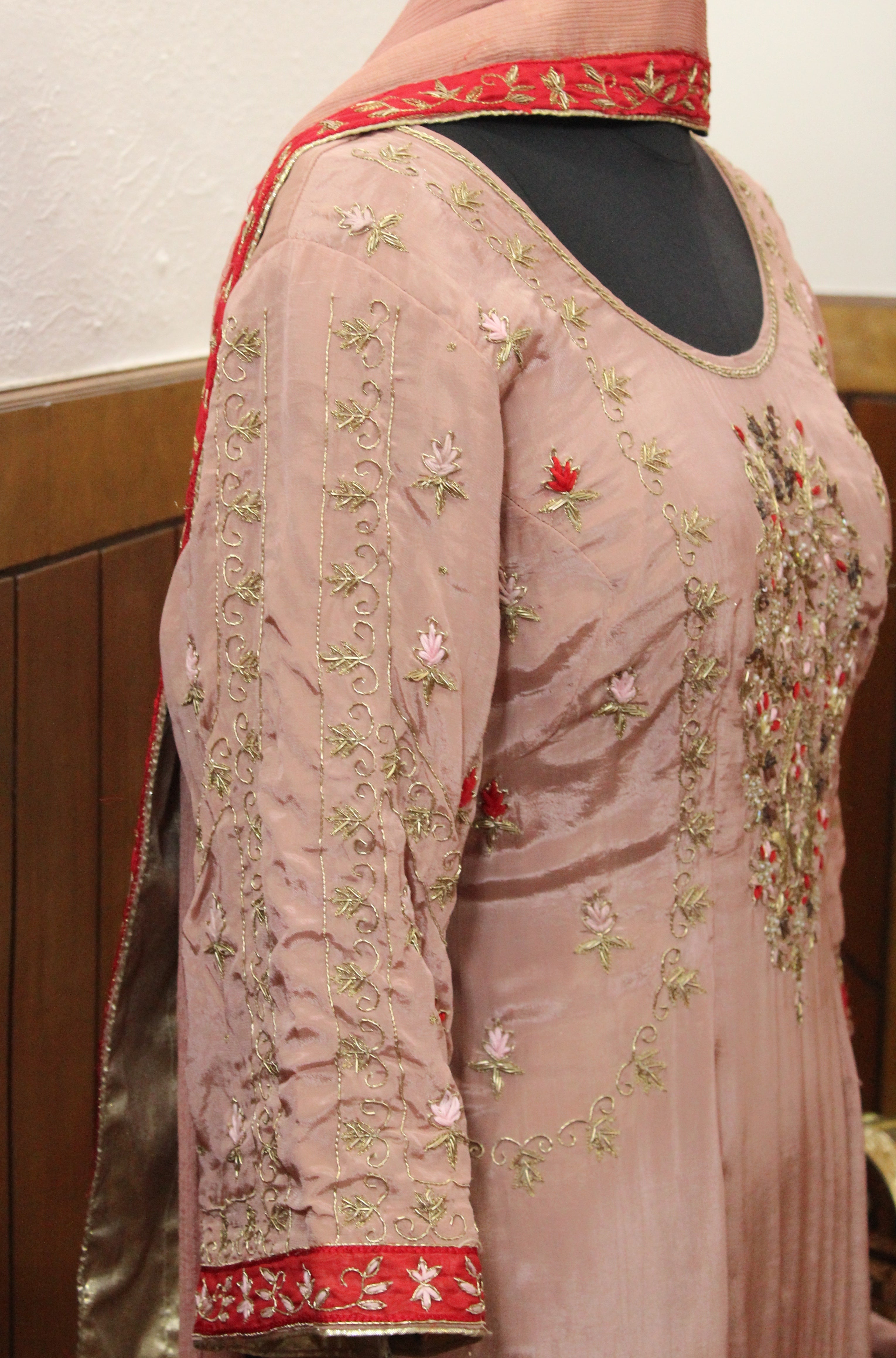 Gentle pink hue with shimmering embroidery