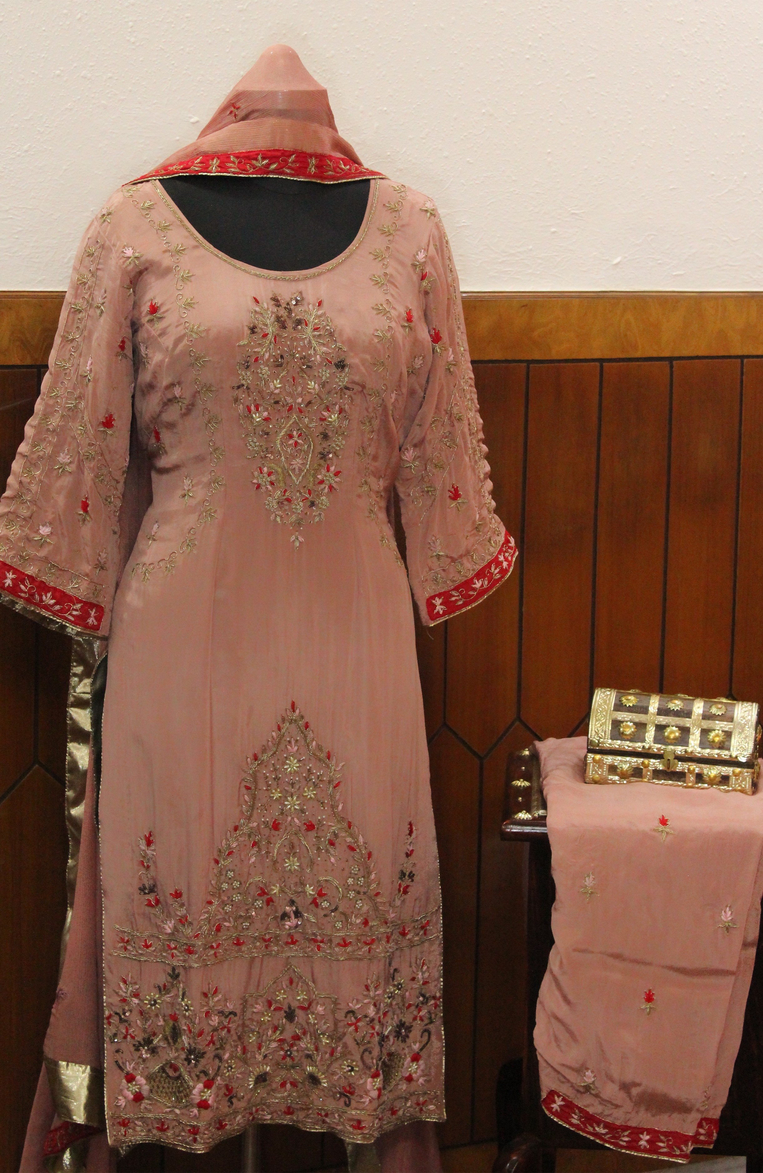 Gentle pink hue with shimmering embroidery